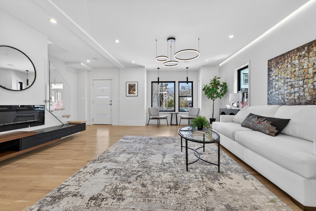 29 Line Street Cambridge, MA 02138 - Photo 17 of 42 a living room with furniture and wooden floor