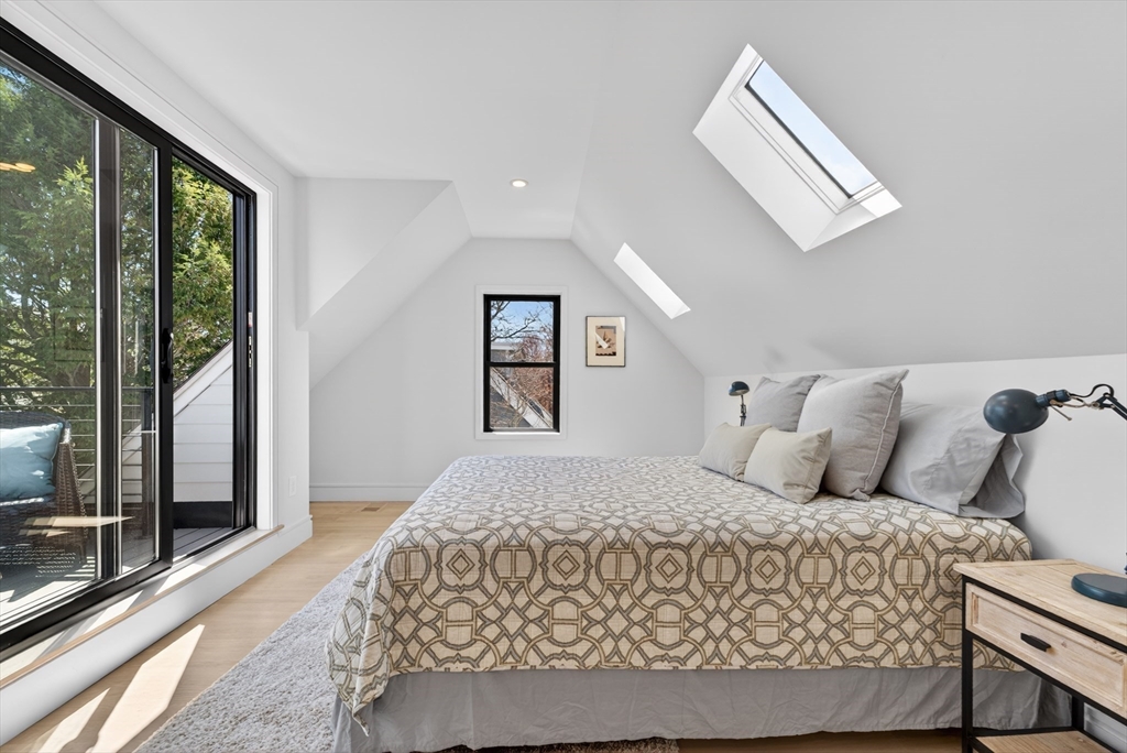 29 Line Street Cambridge, MA 02138 - Photo 27 of 42 a bedroom with a large bed and a window