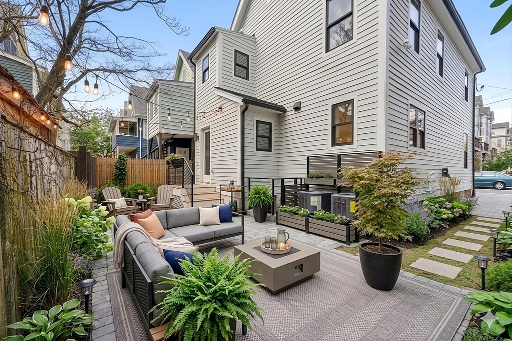 29 Line Street Cambridge, MA 02138 - Photo 3 of 42 a view of a patio with couches and potted plants