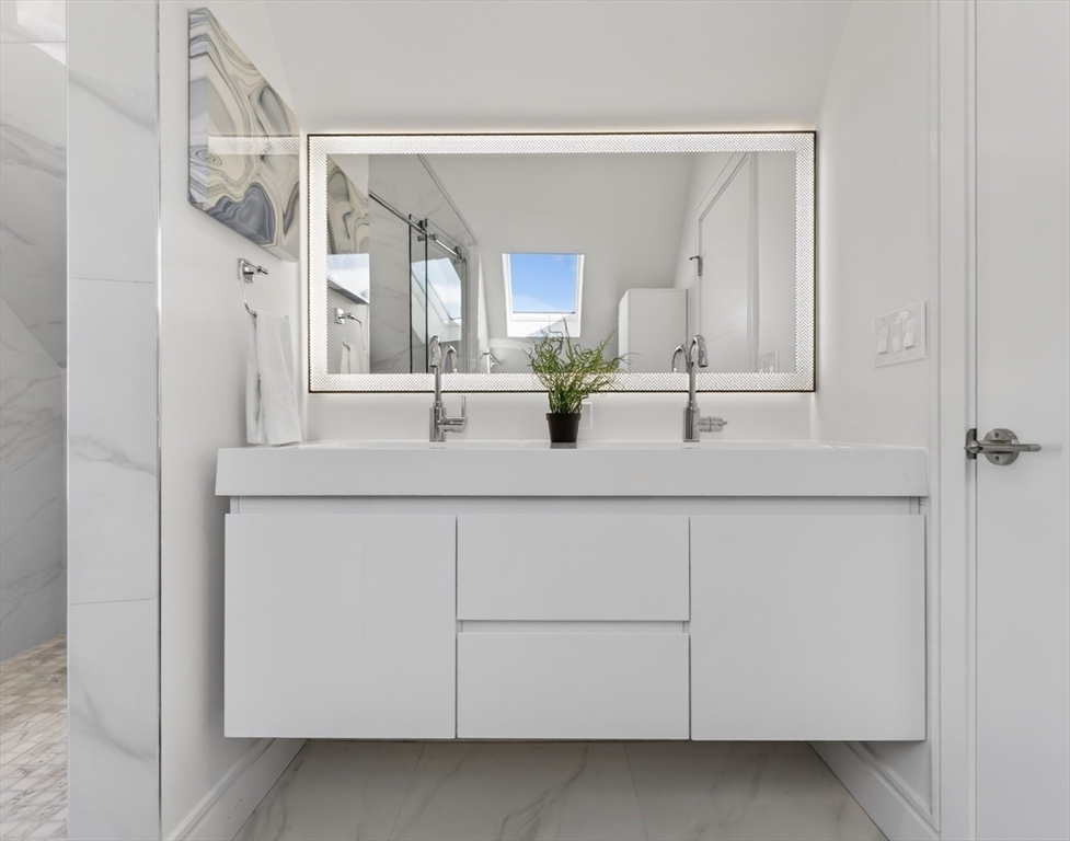 29 Line Street Cambridge, MA 02138 - Photo 37 of 42 a bathroom with a sink and a mirror