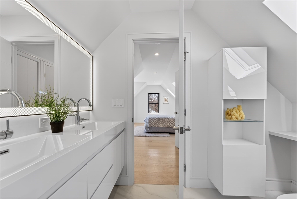 29 Line Street Cambridge, MA 02138 - Photo 38 of 42 a bathroom with a sink a tub and a mirror