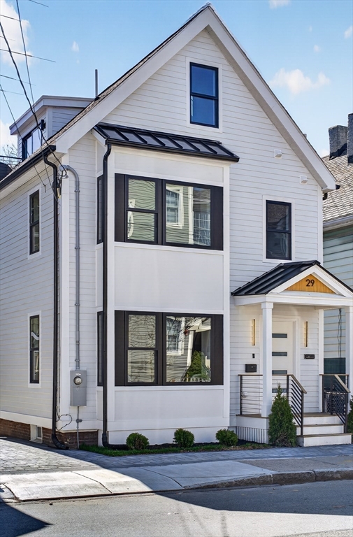 29 Line Street Cambridge, MA 02138 - Photo 39 of 42 a front view of a house with a yard