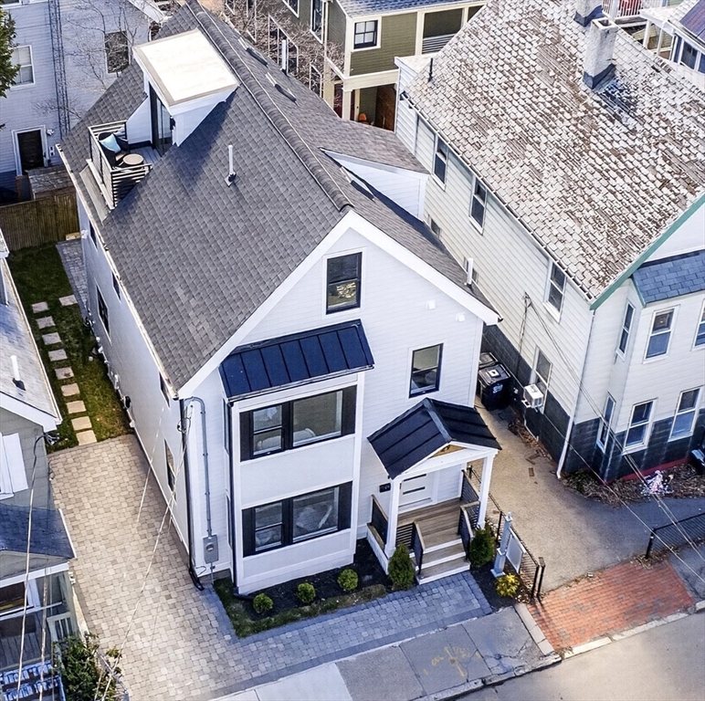 29 Line Street Cambridge, MA 02138 - Photo 41 of 42 a view of a patio with a table and chairs