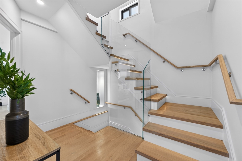29 Line Street Cambridge, MA 02138 - Photo 6 of 42 a view of entryway with wooden floor and stairs