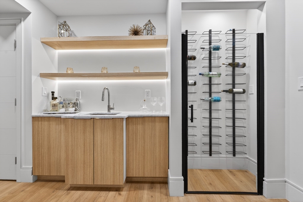 29 Line Street Cambridge, MA 02138 - Photo 8 of 42 a view of walk in closet with clothes and shoes