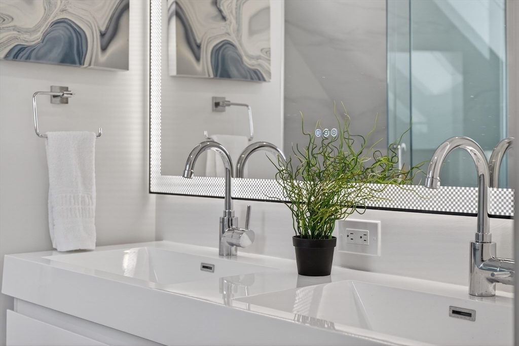 29 Line Street Cambridge, MA 02138 - Photo 9 of 42 a bathroom with a bathtub sink and vanity