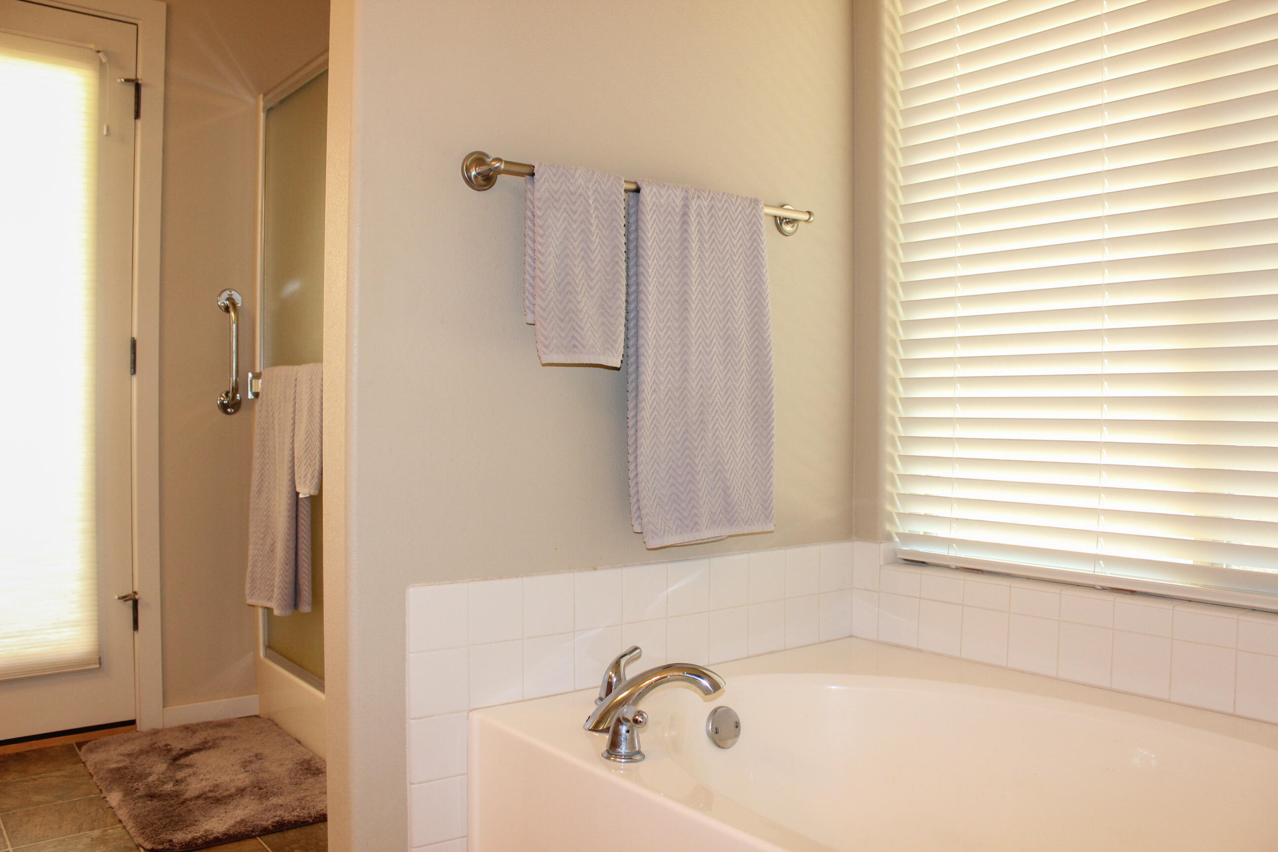 705 Three Pines Road Grants Pass, OR 97526 - Photo 43 of 47 a bathroom with a bathtub and a window