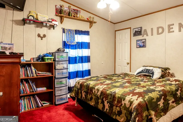 a bedroom with a bed and a book shelf