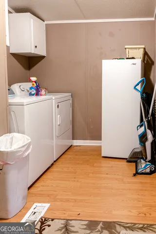 a bathroom with a sink toilet and a mirror
