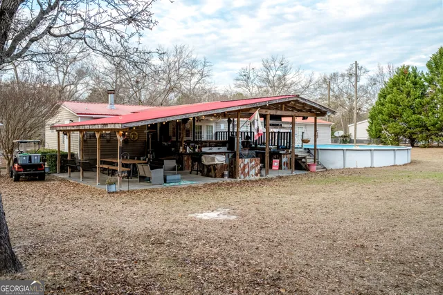 a view of a house with a porch patio and furniture