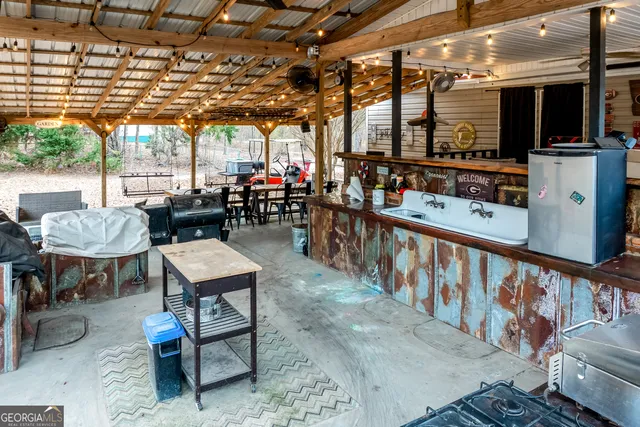 a view of a chairs and table in a patio