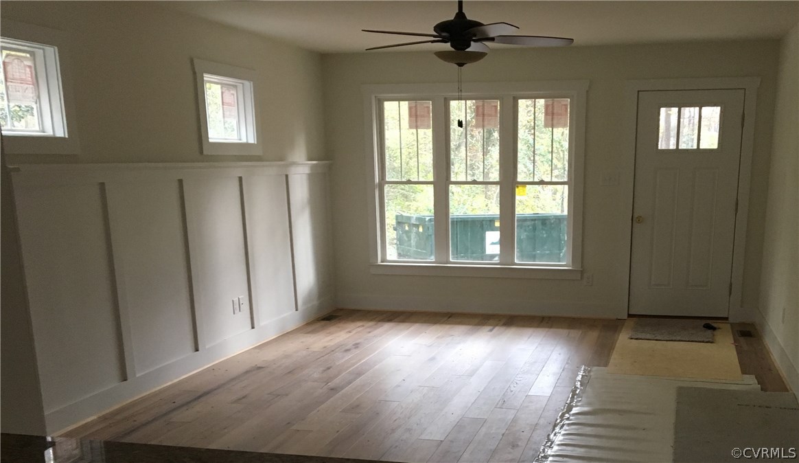 3936 Wood Dale Road Chester, VA 23831 - Photo 11 of 34 a view of an empty room with a window and wooden floor
