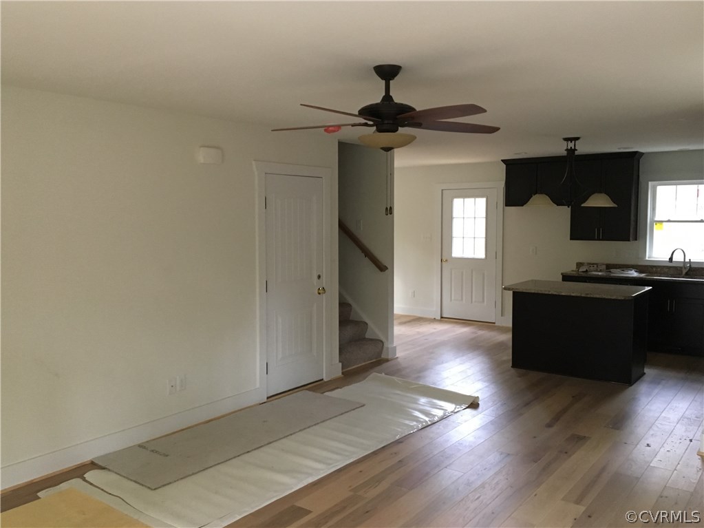 3936 Wood Dale Road Chester, VA 23831 - Photo 12 of 34 a kitchen with stainless steel appliances granite countertop a refrigerator a stove and a wooden floors