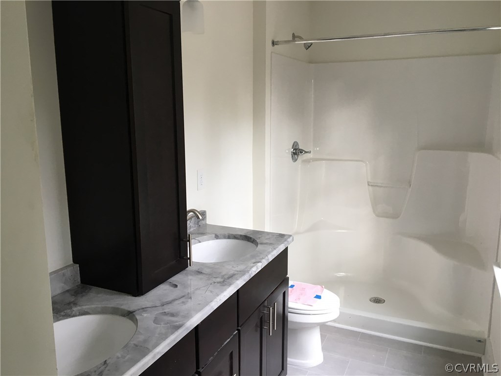 3936 Wood Dale Road Chester, VA 23831 - Photo 24 of 34 a bathroom with a granite countertop sink toilet and shower