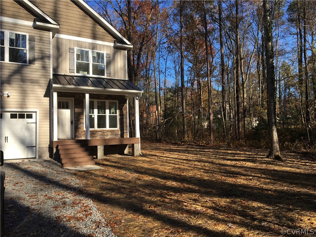 3936 Wood Dale Road Chester, VA 23831 - Photo 3 of 34 a front view of a house with a yard