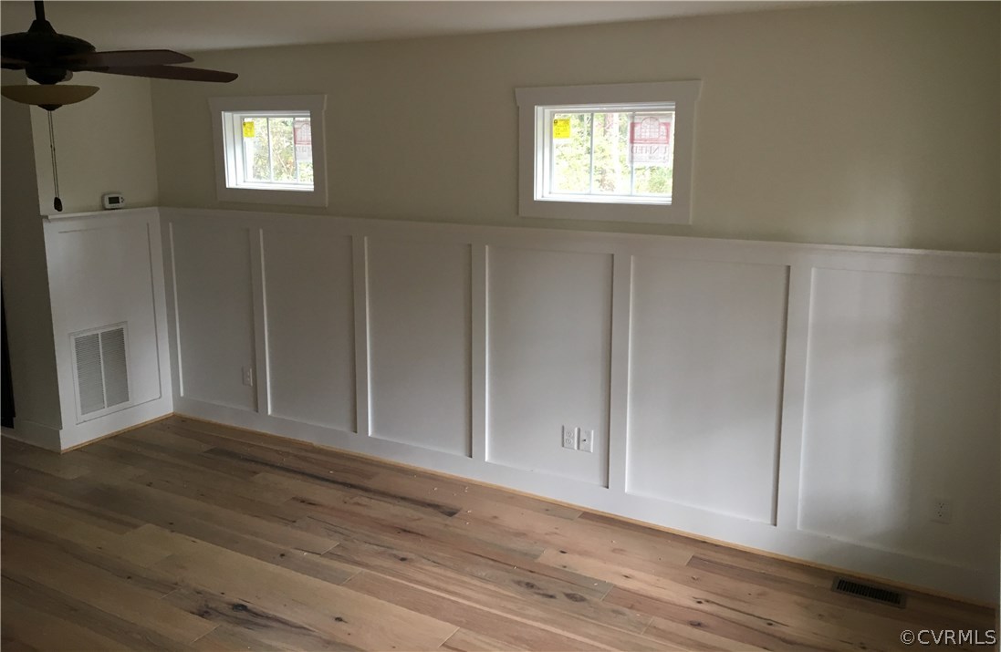 3936 Wood Dale Road Chester, VA 23831 - Photo 10 of 34 a view of an empty room with wooden floor and a window