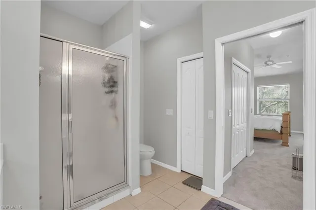 a bathroom with a glass shower door