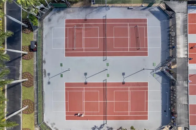 an aerial view of a chairs and table in the patio