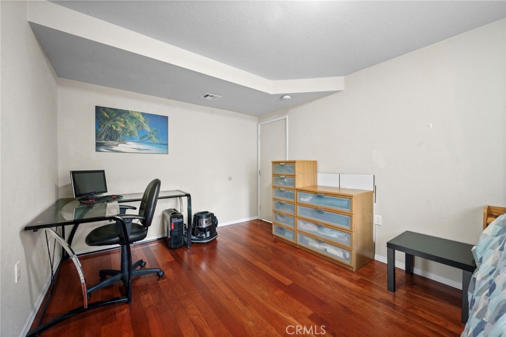 605 Bronco Way Walnut, CA 91789 - Photo 22 of 69 a view of a workspace with furniture and wooden floor