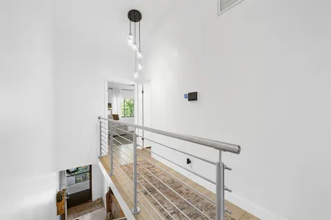 a view of a hallway with staircase