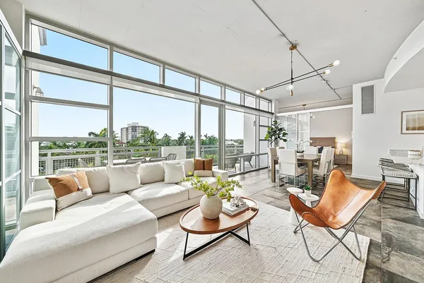 a living room with furniture and a large window
