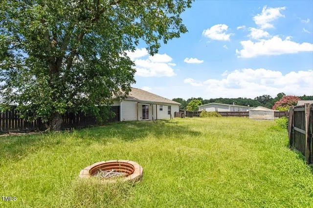 a view of a lake with a yard