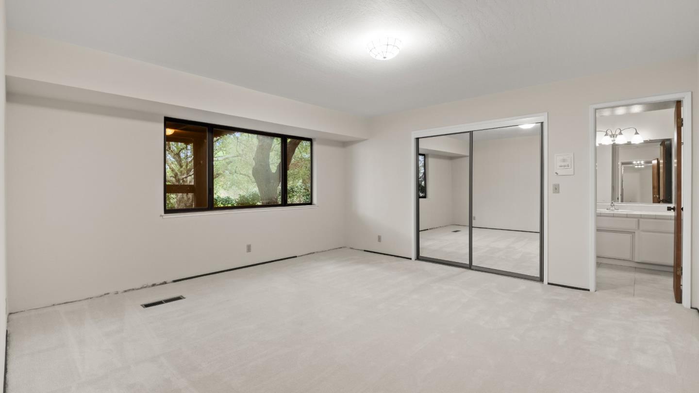 16353 Aztec Ridge Drive Los Gatos, CA 95030 - Photo 48 of 61 an empty room with a empty space and windows