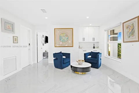 a living room with furniture and window