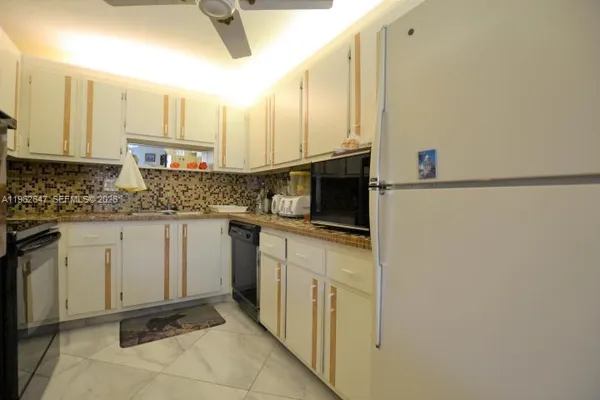 a kitchen with a sink cabinets and counter space
