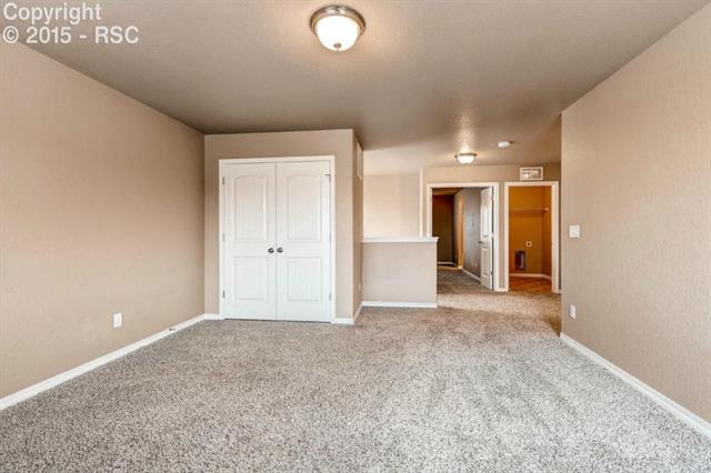 944 Diamond Rim Drive Colorado Springs, CO 80921 - Photo 27 of 28 Wide open access from top of stairs almost a foyer feel.