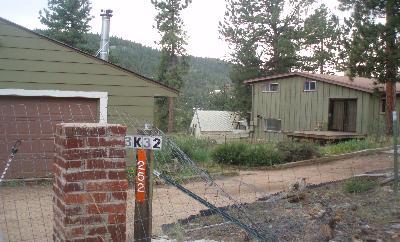 252 Hall Road Bailey, CO 80421 - Photo 1 of 1 a front view of a house with garden
