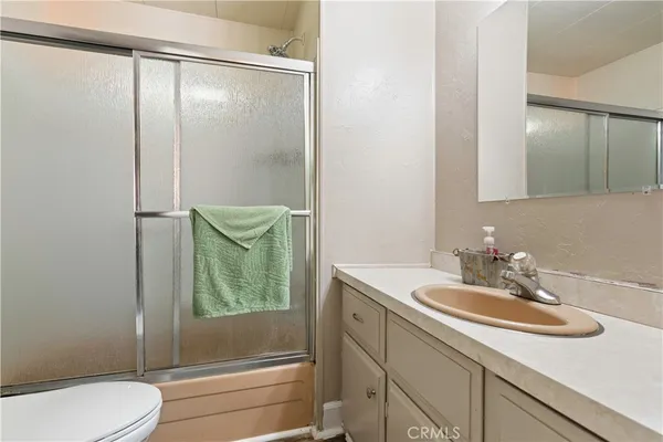 a bathroom with a toilet and a sink