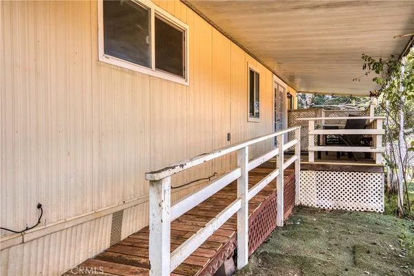 a view of a house with a snow in the background