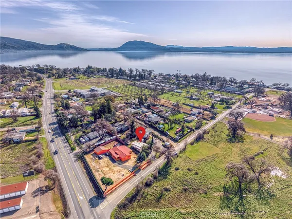 an aerial view of residential houses and outdoor space