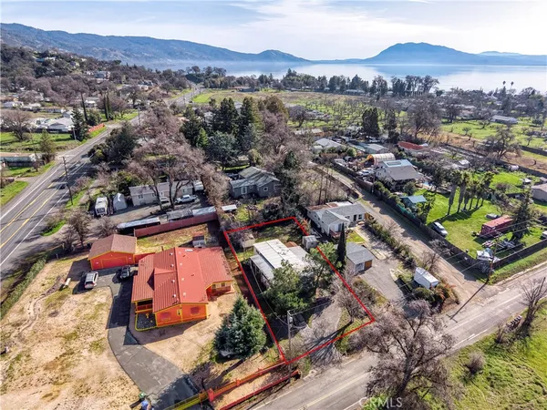an aerial view of a residential houses and city street