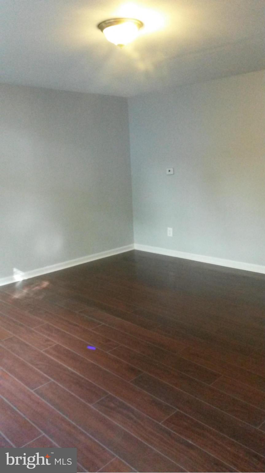 3304 Bero Road Baltimore, MD 21227 - Photo 14 of 27 a view of room with wooden floor