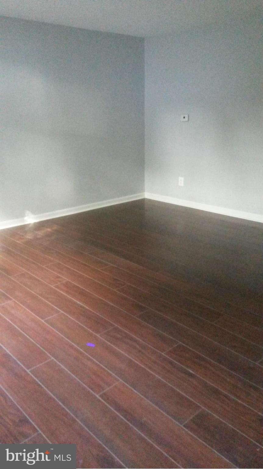3304 Bero Road Baltimore, MD 21227 - Photo 15 of 27 a view of room with wooden floor