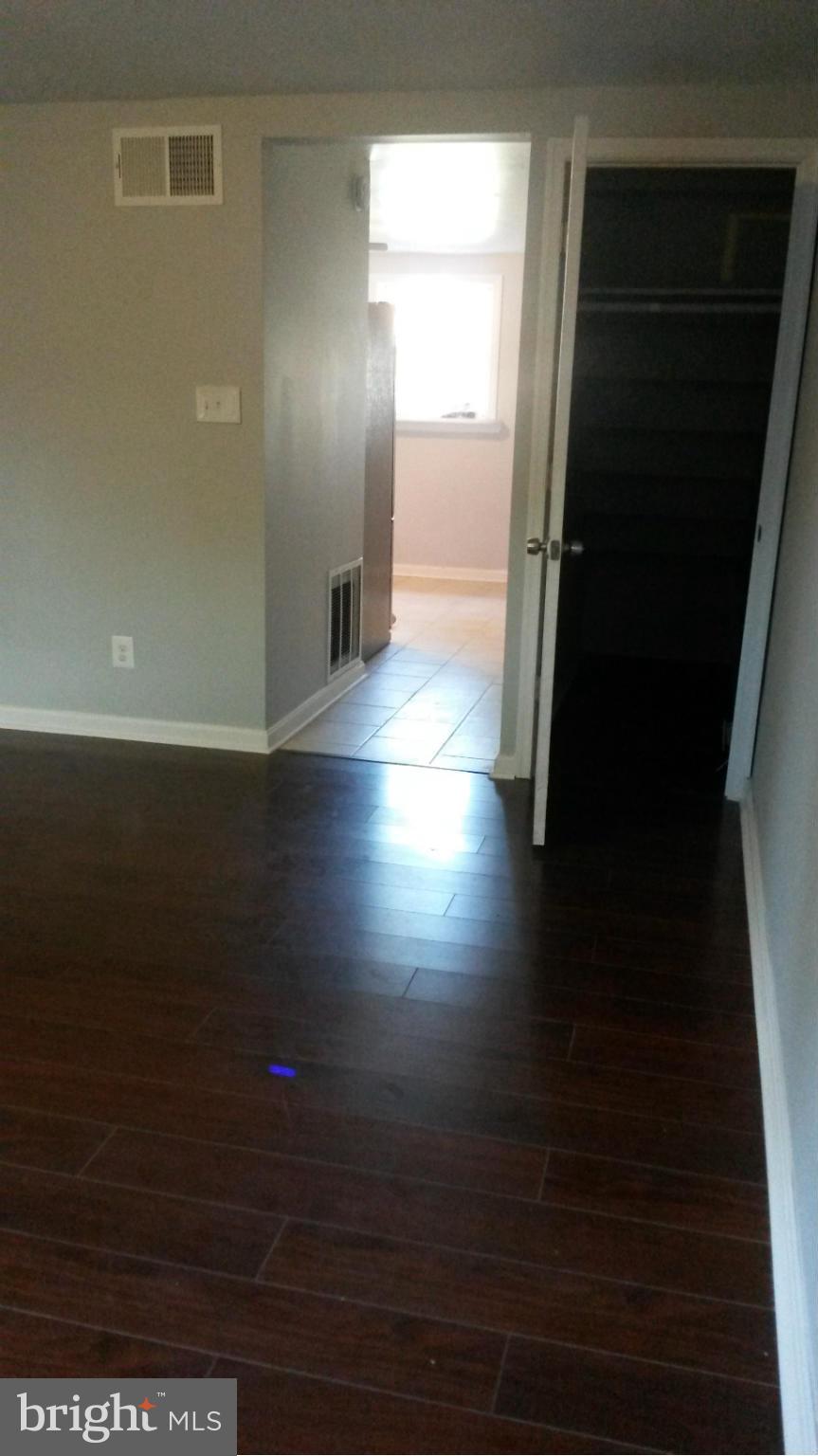 3304 Bero Road Baltimore, MD 21227 - Photo 16 of 27 a view of empty room with wooden floor