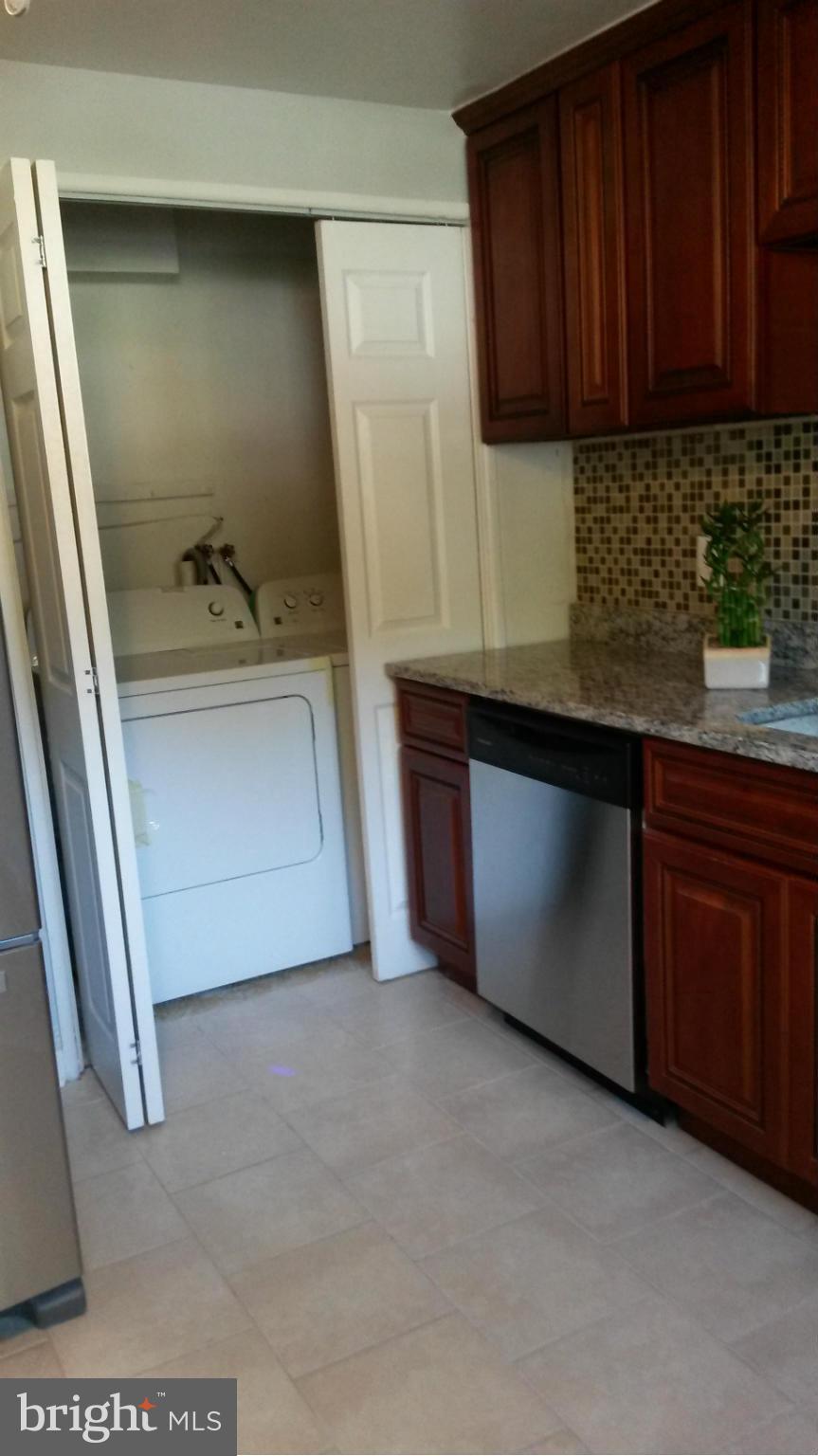 3304 Bero Road Baltimore, MD 21227 - Photo 3 of 27 a kitchen with a sink and cabinets