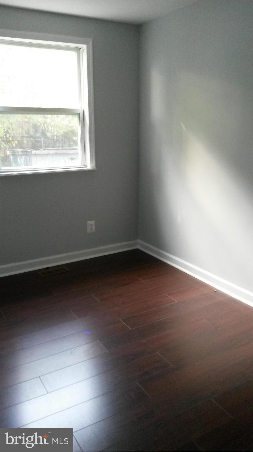 3304 Bero Road Baltimore, MD 21227 - Photo 26 of 27 an empty room with a window