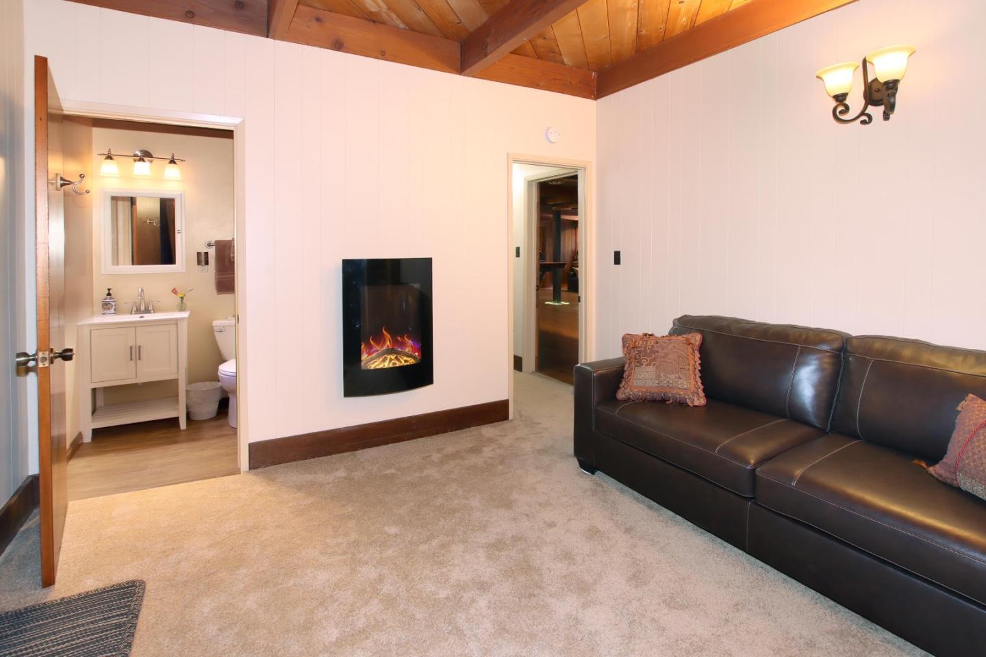 16770 Redwood Lodge Road Los Gatos, CA 95033 - Photo 110 of 122 a living room with furniture and a flat screen tv