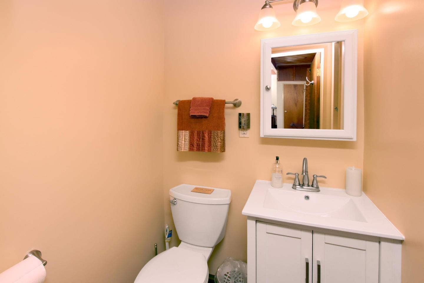 16770 Redwood Lodge Road Los Gatos, CA 95033 - Photo 113 of 122 a bathroom with a toilet sink and mirror