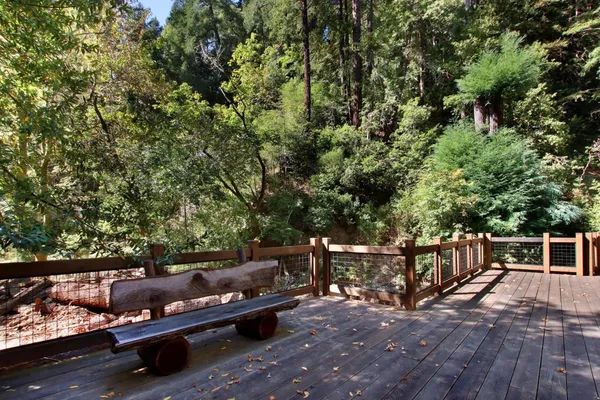 a view of balcony with wooden floor and outdoor seating