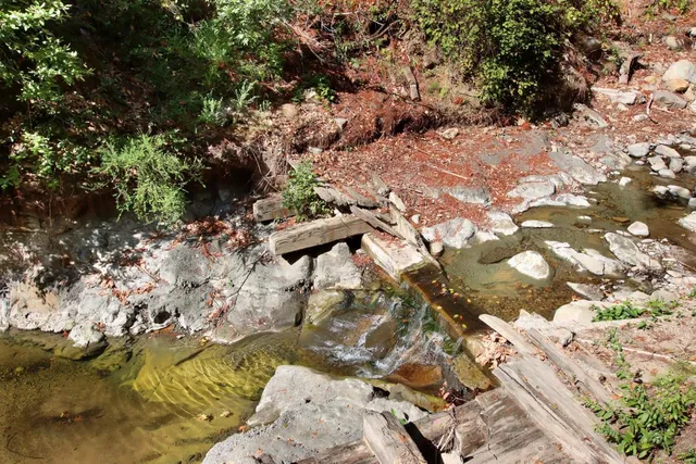 a view of a patio with furniture and a fire pit