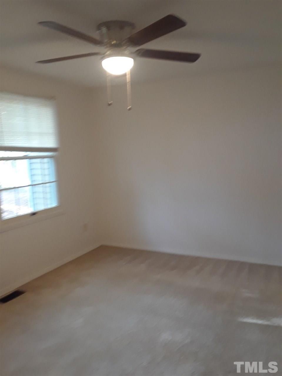 7762 Sandra Lane Raleigh, NC 27615 - Photo 7 of 9 a view of an empty room