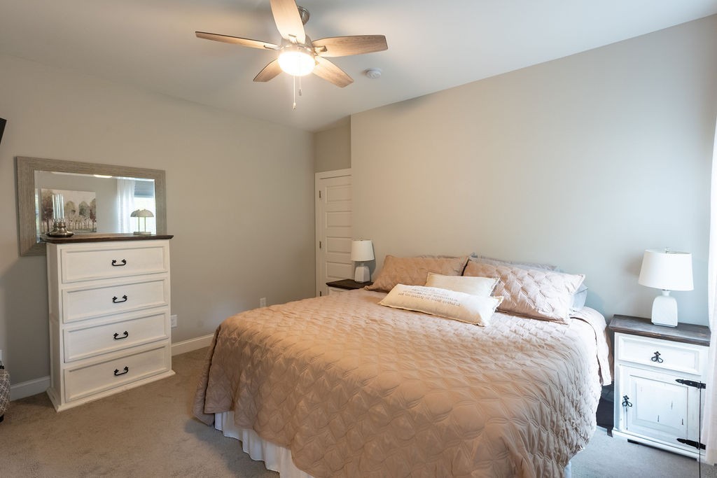 1578 Old Gallatin Road Portland, TN 37148 - Photo 17 of 32 a bedroom with a bed and a night stand