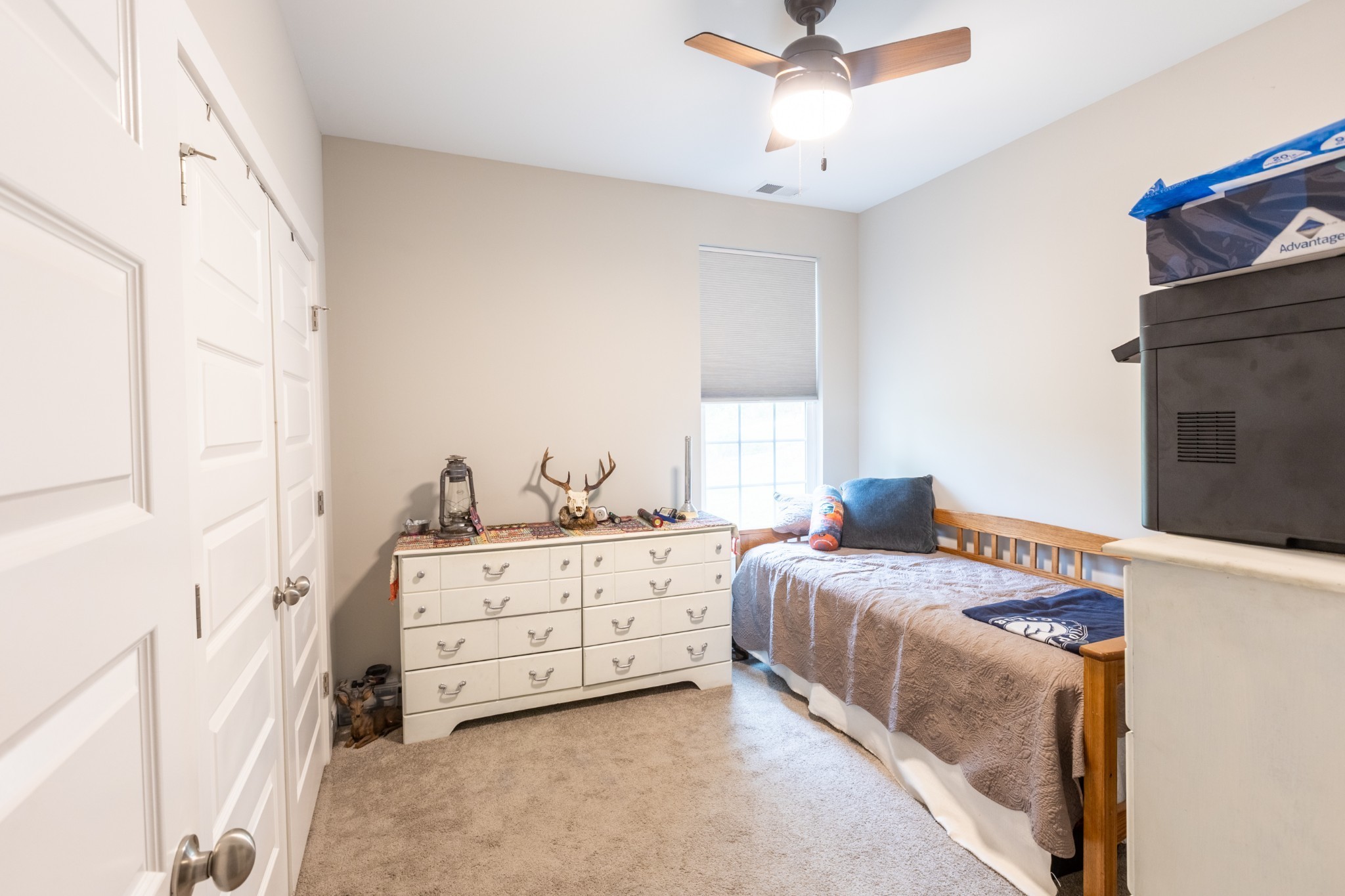 1578 Old Gallatin Road Portland, TN 37148 - Photo 22 of 32 a bedroom with a bed and a ceiling fan