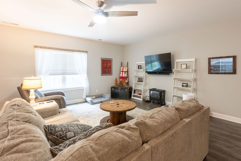 1578 Old Gallatin Road Portland, TN 37148 - Photo 24 of 32 a living room with furniture a flat screen tv and a window
