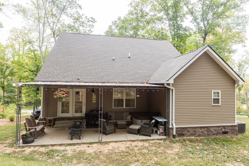 1578 Old Gallatin Road Portland, TN 37148 - Photo 6 of 32 a backyard of a house with outdoor seating and barbeque oven