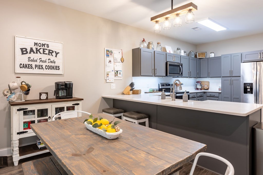 1578 Old Gallatin Road Portland, TN 37148 - Photo 9 of 32 a kitchen with a table and chairs in it